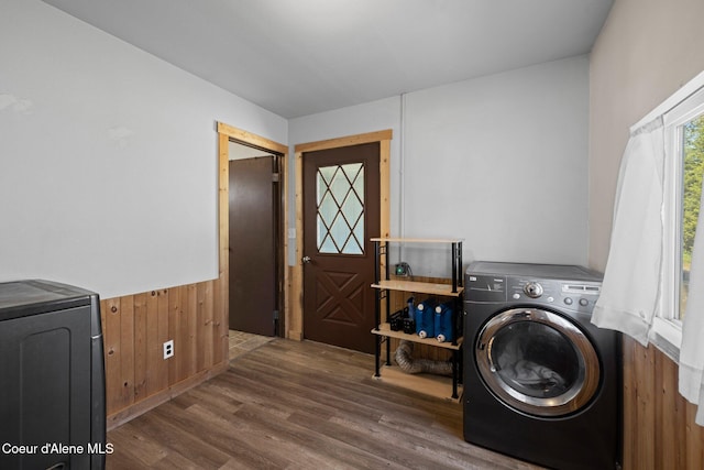 5739 W Maine St, Spirit Lake, ID 83869 - washroom featuring wood finished floors, washer and dryer, wainscoting, and wooden walls