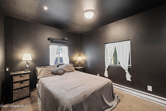 5739 W Maine St, Spirit Lake, ID 83869 - carpeted bedroom with a baseboard radiator and baseboards