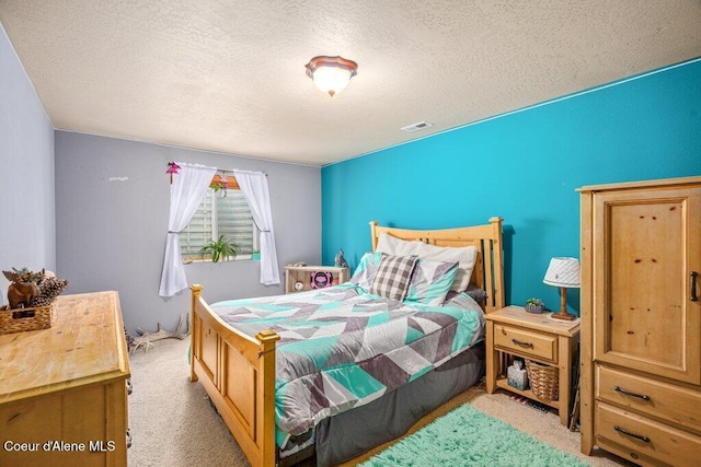 8558 N Boysenberry Loop, Hayden, ID 83835 - bedroom featuring carpet and a textured ceiling