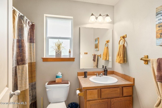 8558 N Boysenberry Loop, Hayden, ID 83835 - bathroom featuring toilet and vanity