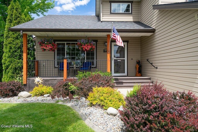 8558 N Boysenberry Loop, Hayden, ID 83835 - property entrance with a porch and roof with shingles