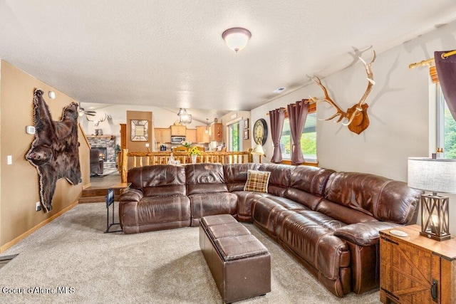 8558 N Boysenberry Loop, Hayden, ID 83835 - carpeted living room featuring plenty of natural light and a textured ceiling