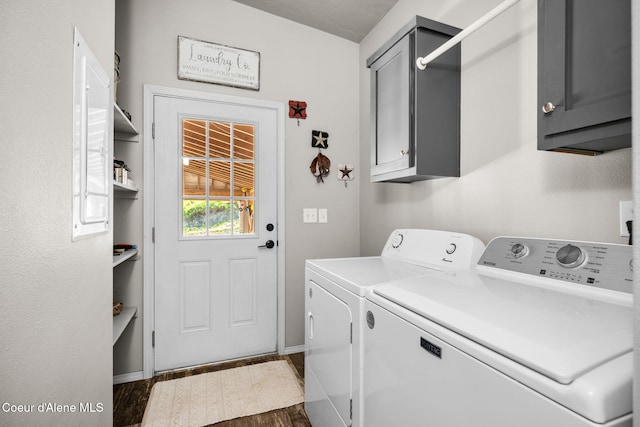 1446 Sagle Creek Rd, Sagle, ID 83860 - washroom with cabinet space, washer and clothes dryer, dark wood-style flooring, and baseboards