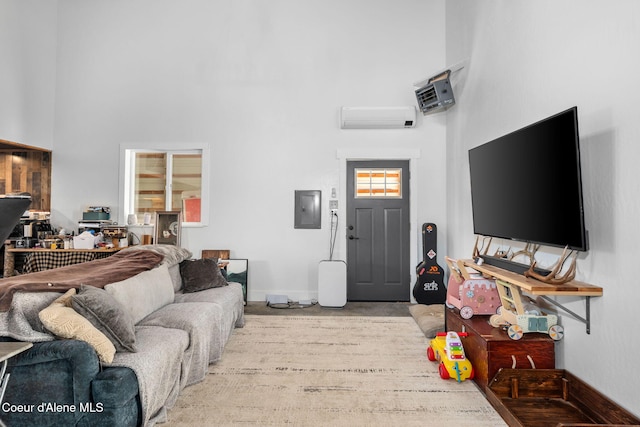 1446 Sagle Creek Rd, Sagle, ID 83860 - living room with a towering ceiling, electric panel, a wall mounted AC, and baseboards