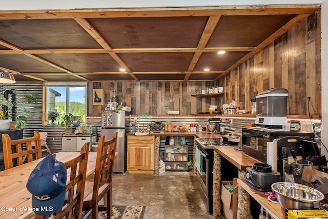 1446 Sagle Creek Rd, Sagle, ID 83860 - kitchen with butcher block counters, stainless steel appliances, concrete flooring, wood walls, and open shelves