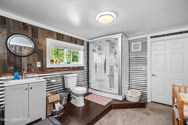 1446 Sagle Creek Rd, Sagle, ID 83860 - full bath with a stall shower, toilet, vanity, concrete flooring, and wood walls