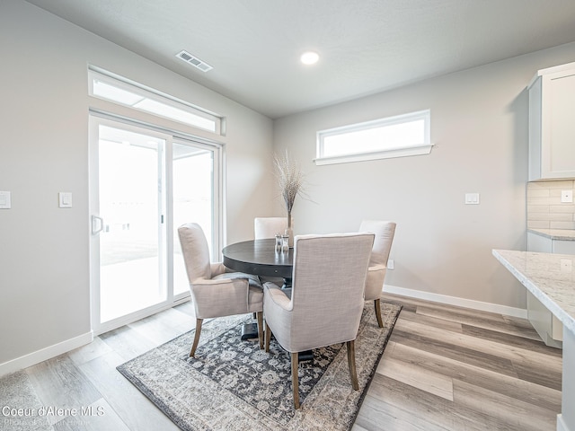 13668 N Apex Way, Hayden, ID 83835 - dining area featuring light wood finished floors, baseboards, and recessed lighting