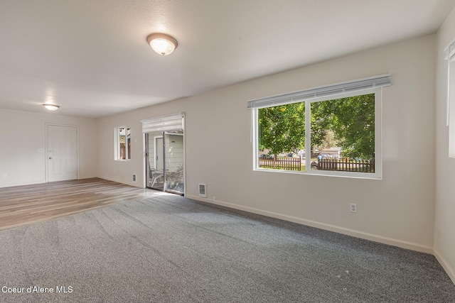 1611 E Birch St, Coeur Dalene, ID 83814 - carpeted empty room with baseboards and plenty of natural light