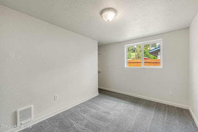 1611 E Birch St, Coeur Dalene, ID 83814 - spare room featuring carpet flooring, baseboards, a textured ceiling, and heating unit