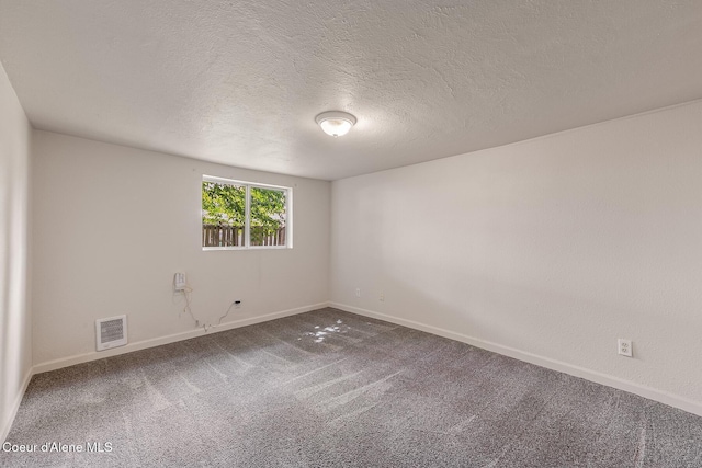 1611 E Birch St, Coeur Dalene, ID 83814 - carpeted spare room with baseboards and a textured ceiling