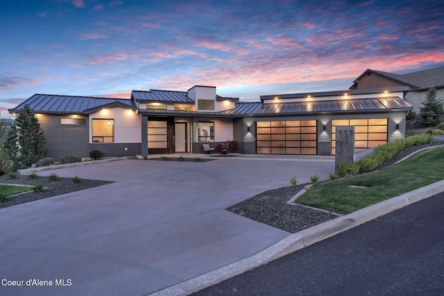 175 N Holidays Hills Dr, Liberty Lake, WA 99019 - modern home with a standing seam roof, metal roof, a garage, and driveway