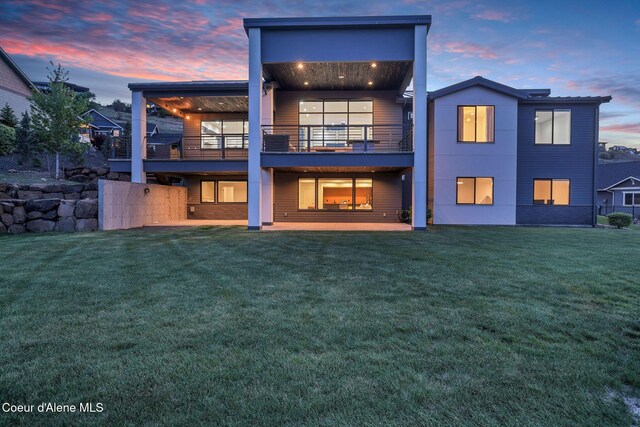 175 N Holidays Hills Dr, Liberty Lake, WA 99019 - back of property with a balcony, a lawn, and a patio area