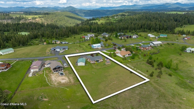 30587 S Sunray Trl, Worley, ID 83876 - view of property location featuring a heavily wooded area, a mountainous background, and property boundaries highlighted