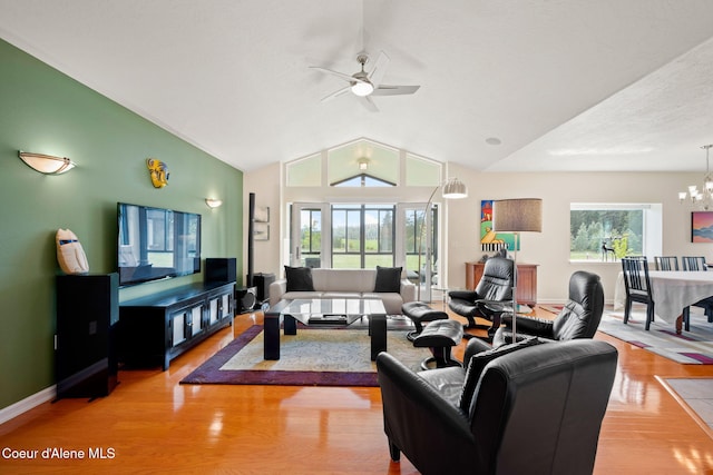 30587 S Sunray Trl, Worley, ID 83876 - living area featuring ceiling fan, lofted ceiling, a chandelier, light wood finished floors, and baseboards