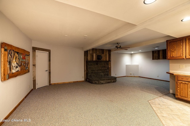 2720 Hayden Ave, Hayden, ID 83835 - unfurnished living room featuring a fireplace, baseboards, light carpet, and a ceiling fan