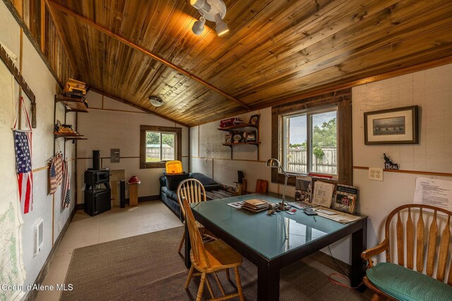 2720 Hayden Ave, Hayden, ID 83835 - dining space with a wood stove, wooden ceiling, and vaulted ceiling