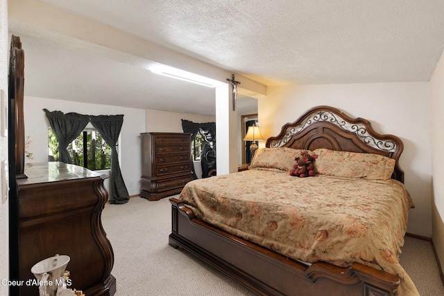 910 Otts Rd, Sagle, ID 83860 - bedroom featuring light colored carpet, a textured ceiling, and baseboards