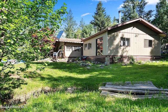 910 Otts Rd, Sagle, ID 83860 - rear view of house with a lawn