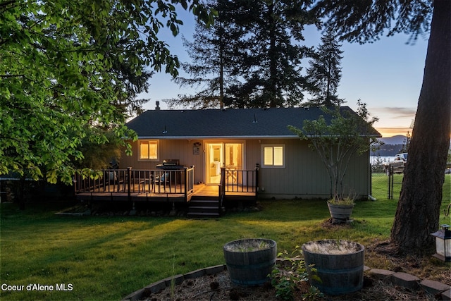 9298 N Clarkview Pl, Hayden, ID 83835 - back of house at dusk with a deck