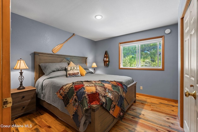 723 Trout Crk Rd, Sandpoint, ID 83864 - bedroom with wood finished floors and a closet