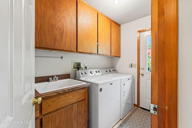 723 Trout Crk Rd, Sandpoint, ID 83864 - laundry room with washer and clothes dryer and cabinet space