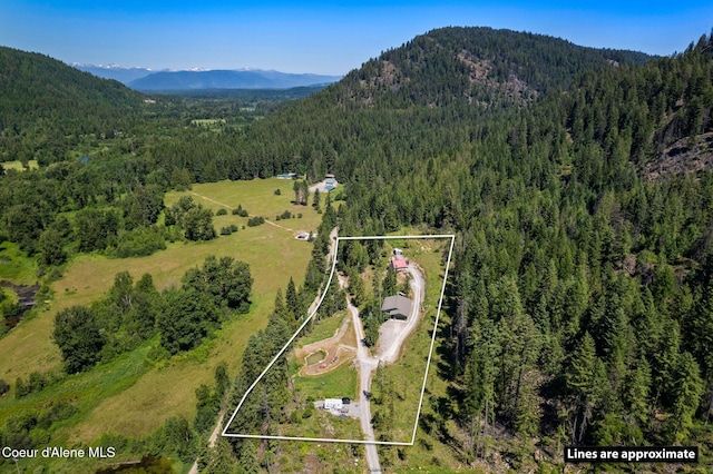723 Trout Crk Rd, Sandpoint, ID 83864 - aerial view of property's location with a mountain backdrop and property parcel outlined