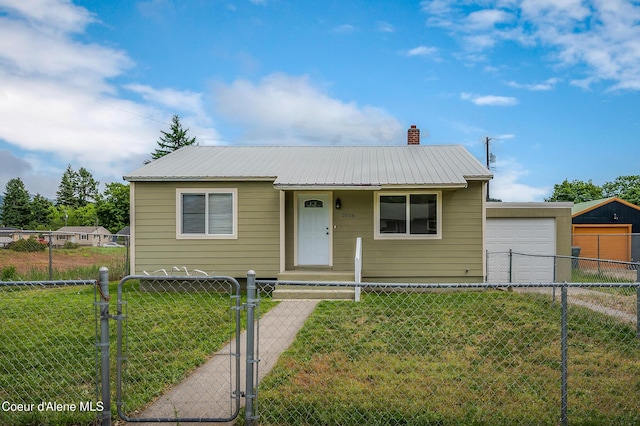 2016 N 7th St, Coeur Dalene, ID 83814 - view of front facade with a gate, metal roof, a chimney, and driveway