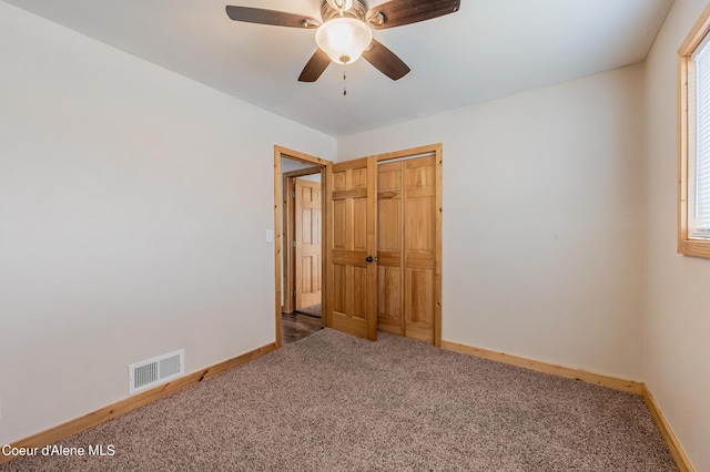 2016 N 7th St, Coeur Dalene, ID 83814 - unfurnished bedroom with carpet flooring, baseboards, ceiling fan, and a closet