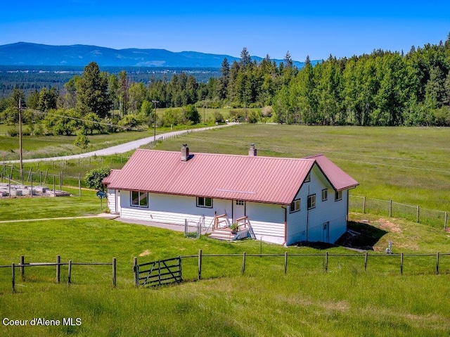 25024 N Derting Rd, Hayden, ID 83835 - aerial view of sparsely populated area featuring a mountain backdrop and a heavily wooded area
