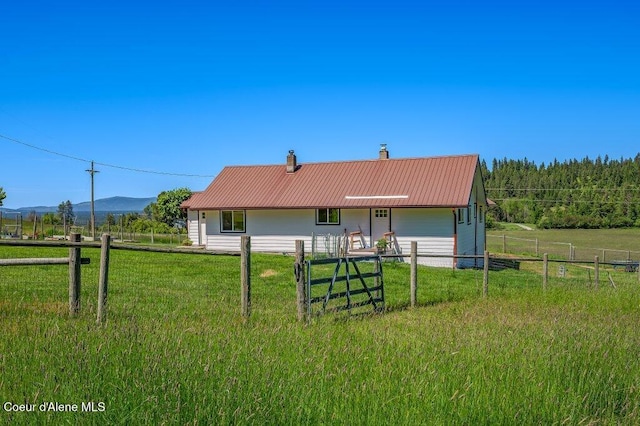 25024 N Derting Rd, Hayden, ID 83835 - view of front of home with a chimney and metal roof