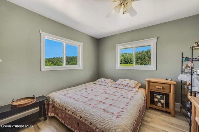 25024 N Derting Rd, Hayden, ID 83835 - bedroom with light wood-style flooring and a ceiling fan