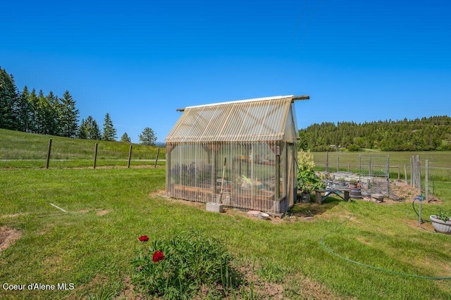25024 N Derting Rd, Hayden, ID 83835 - view of yard with a greenhouse and an outdoor structure