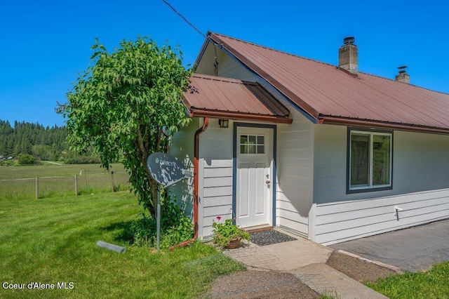 25024 N Derting Rd, Hayden, ID 83835 - view of front of house with metal roof and a chimney