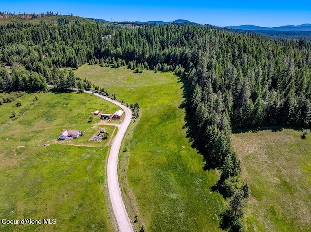 25024 N Derting Rd, Hayden, ID 83835 - bird's eye view of a heavily wooded area and mountains