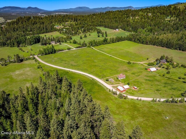25024 N Derting Rd, Hayden, ID 83835 - aerial view of sparsely populated area featuring a forest and a mountainous background