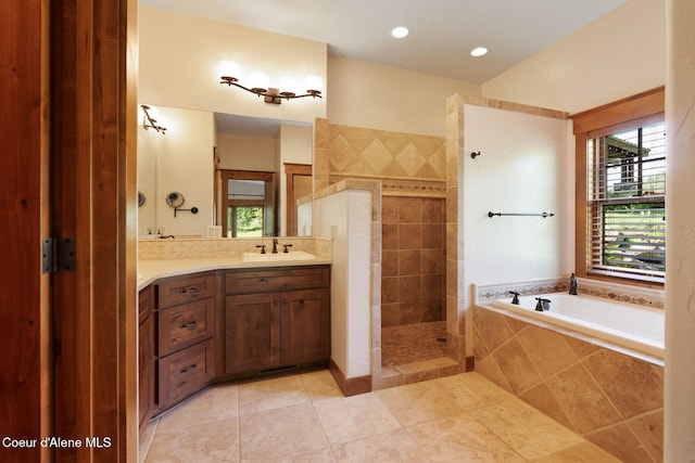409 N Idaho Club Dr, Sandpoint, ID 83864 - full bath featuring vanity, walk in shower, a bath, and tile patterned flooring