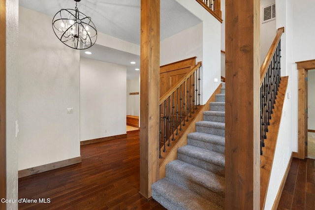 409 N Idaho Club Dr, Sandpoint, ID 83864 - stairway featuring wood-type flooring, recessed lighting, baseboards, and a chandelier
