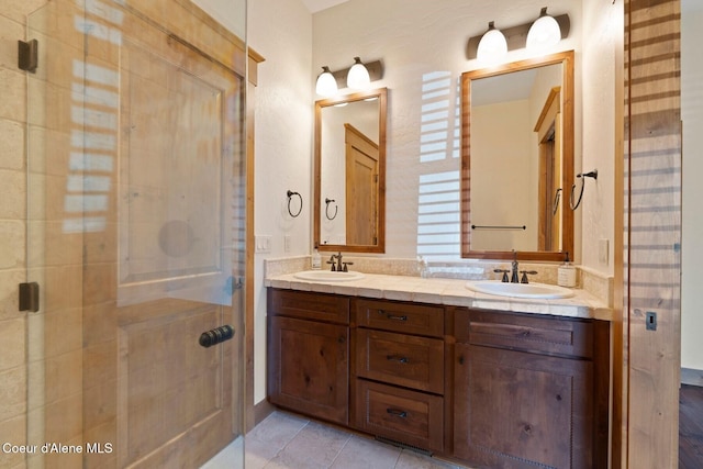 409 N Idaho Club Dr, Sandpoint, ID 83864 - full bathroom featuring double vanity, a shower stall, and tile patterned floors