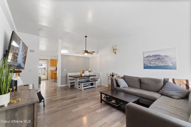 3149 N 12th St, Coeur Dalene, ID 83814 - living room with light wood-style flooring, ceiling fan, and a towering ceiling