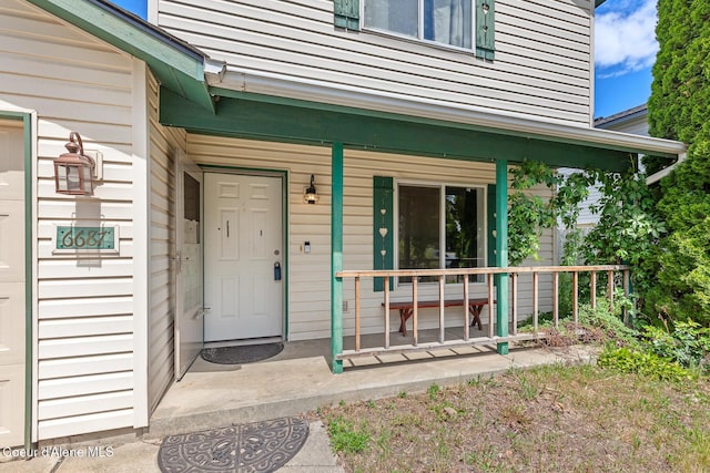 6687 W Flagstaff St, Rathdrum, ID 83858 - doorway to property featuring covered porch