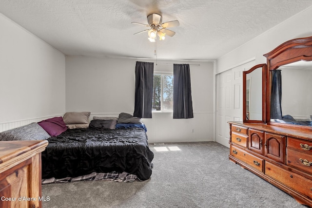 6687 W Flagstaff St, Rathdrum, ID 83858 - bedroom featuring carpet, a textured ceiling, and ceiling fan