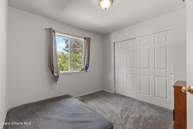 6687 W Flagstaff St, Rathdrum, ID 83858 - unfurnished bedroom featuring carpet flooring, a closet, and baseboards