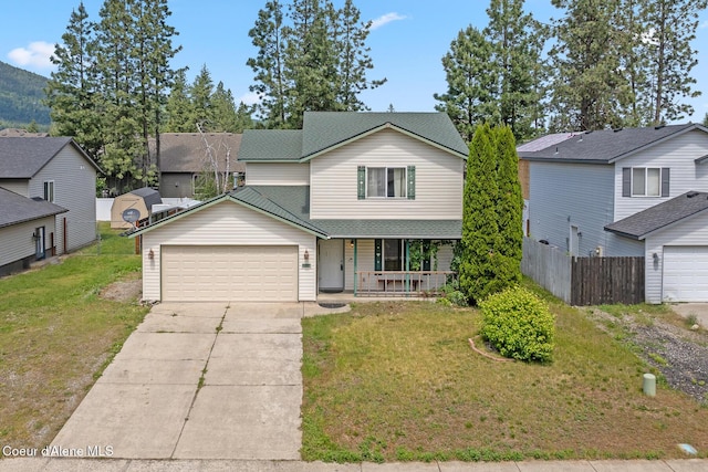 6687 W Flagstaff St, Rathdrum, ID 83858 - traditional-style house featuring a porch, a garage, driveway, and roof with shingles