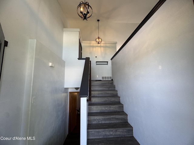8309 N Vantage Dr, Hayden, ID 83835 - staircase with a chandelier