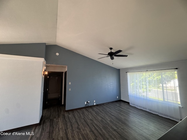 8309 N Vantage Dr, Hayden, ID 83835 - empty room featuring dark wood finished floors, vaulted ceiling, ceiling fan, and baseboards