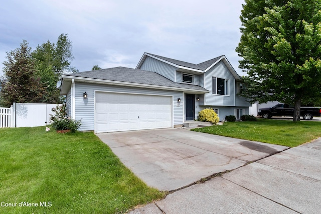 8309 N Vantage Dr, Hayden, ID 83835 - tri-level home featuring concrete driveway and an attached garage