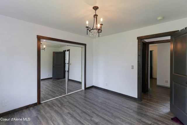 8309 N Vantage Dr, Hayden, ID 83835 - spare room with a chandelier, dark wood finished floors, baseboards, and a smoke detector