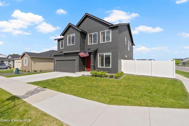 3062 N Coco St, Post Falls, ID 83854 - view of front facade featuring an attached garage, concrete driveway, board and batten siding, and a residential view