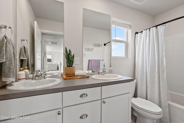 3062 N Coco St, Post Falls, ID 83854 - full bathroom with double vanity, shower / bath combo with shower curtain, and toilet
