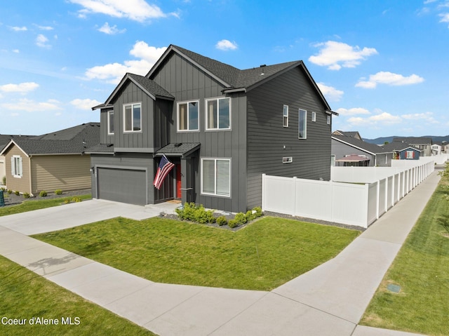 3062 N Coco St, Post Falls, ID 83854 - view of front facade with board and batten siding, an attached garage, driveway, a residential view, and a shingled roof